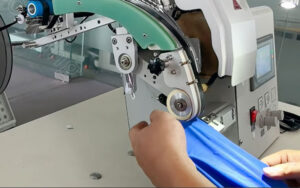 How-to-apply-the-stripe-to-the-fabric-with-a-bonding-machine-seamless-strips-laying-down-machine